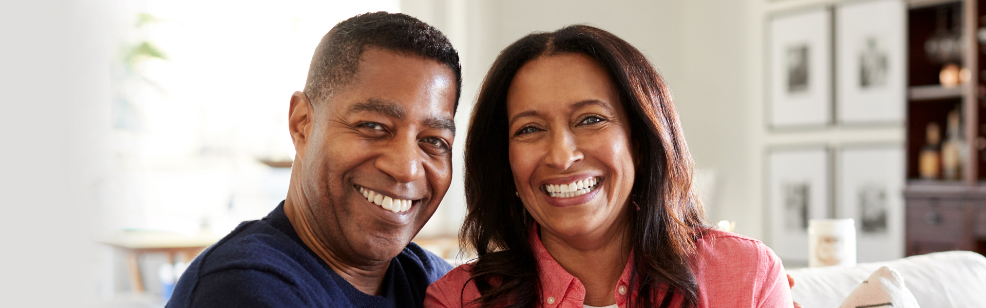 Couple smiling after teeth whitening in Jackson, MI
