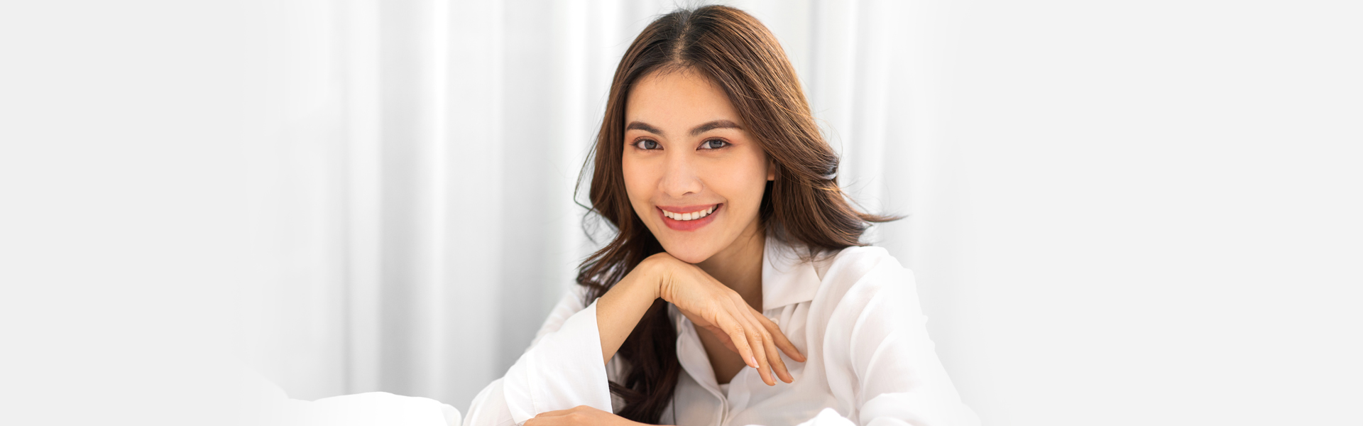 woman smiling after periodontal gum surgery in Jackson, MI